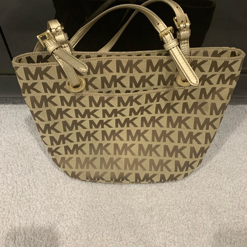A two tone brown/beige MK handbag